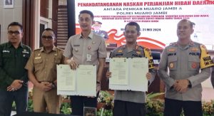 Pj Bupati Muaro Jambi Menghadiri Penandatanganan Naskah Perjanjian Hibah Daerah dengan Polres Muaro Jambi Tahun 2024